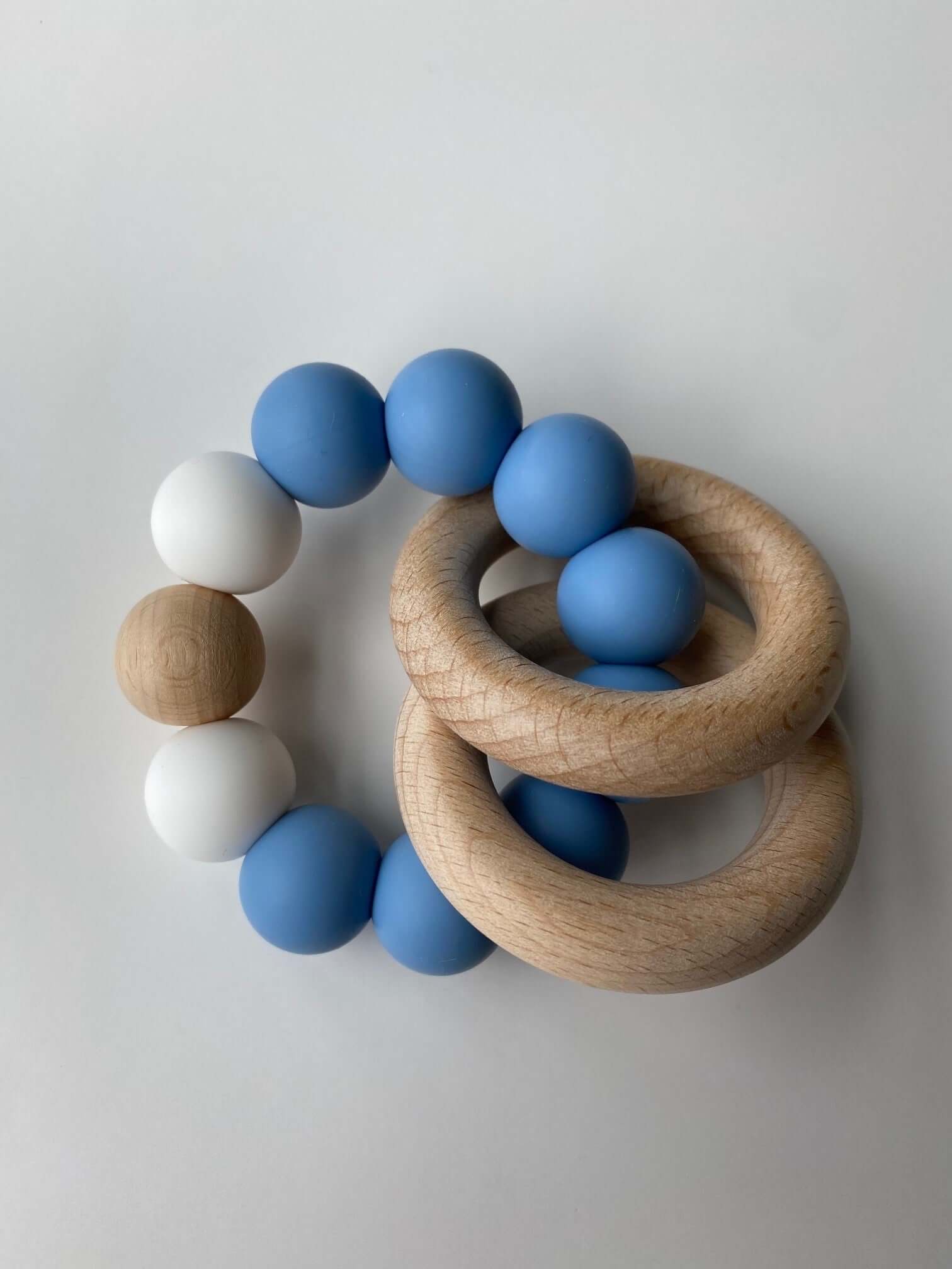 O Ring Rattle Rattle Teething Ring a 2-in-1 teether and rattle!