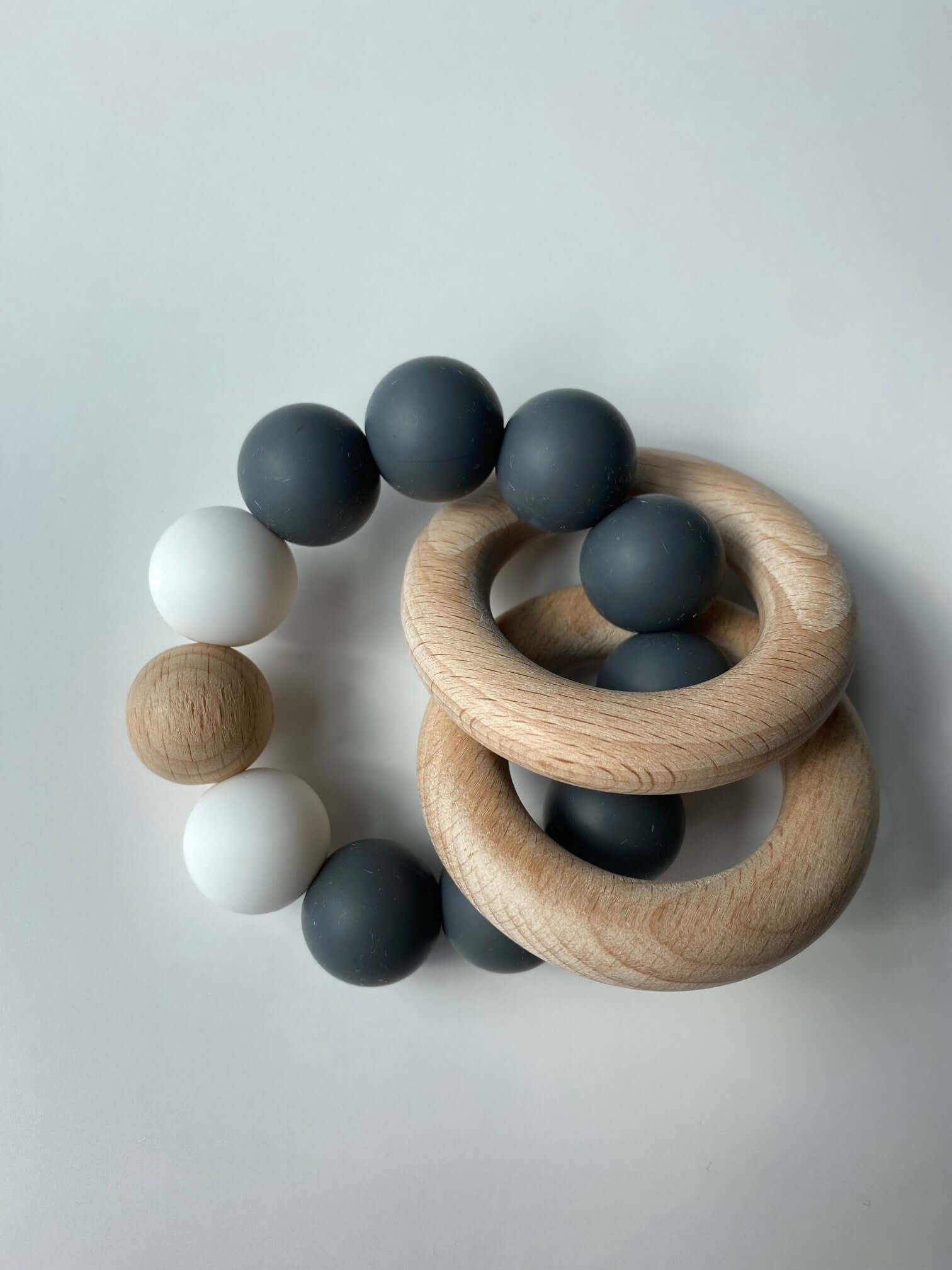 O Ring Rattle Rattle Teething Ring a 2-in-1 teether and rattle!