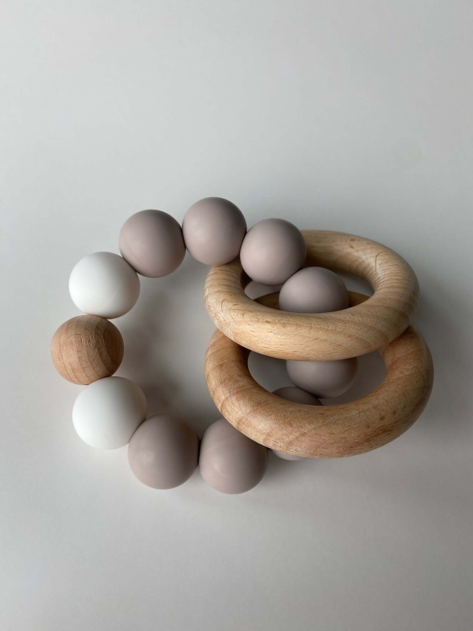 O Ring Rattle Rattle Teething Ring a 2-in-1 teether and rattle!
